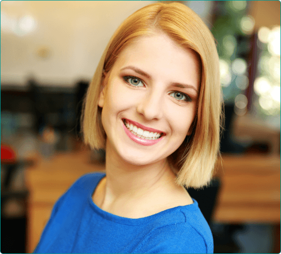 Blonde woman smiling after cosmetic dentistry in Bangor