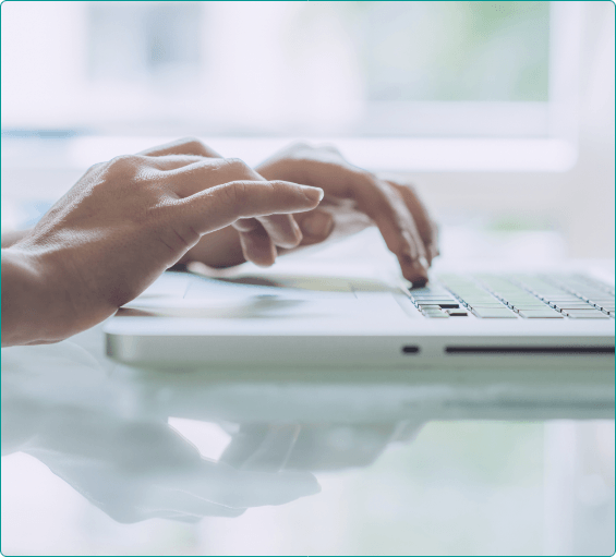 Person typing on laptop