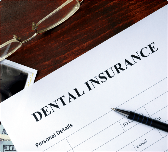 Dental insurance form on wooden table