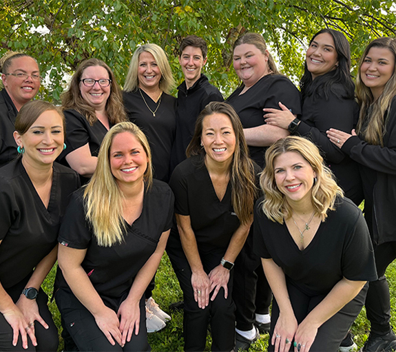Smiling dental team members at Creative Dental Solutions in Bangor
