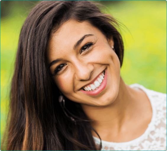 Young woman smiling outdoors